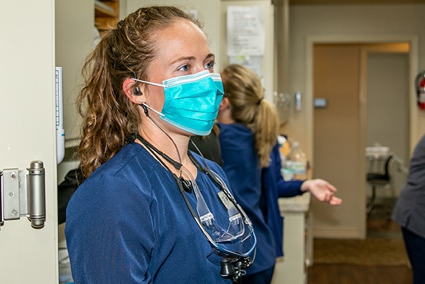 Dental team member wearing a protective face mask