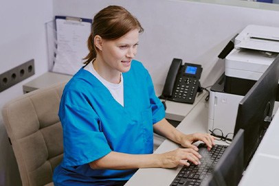 Dental team member working at computer