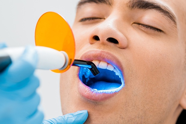 Patient receiving cosmetic dental bonding