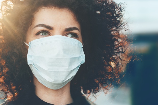 Dental patient wearing a protective face mask