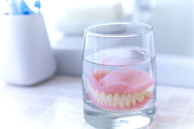 Dentures in Bedford soaking in glass