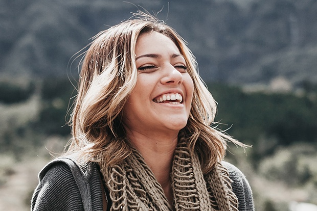 Dental patient smiling after dental visit