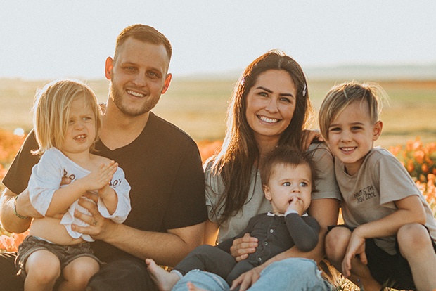 Happy family smiling together after visiting the dentist