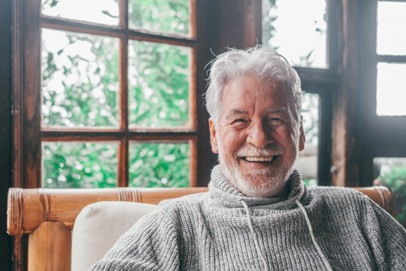 Closeup of senior man smiling at home
