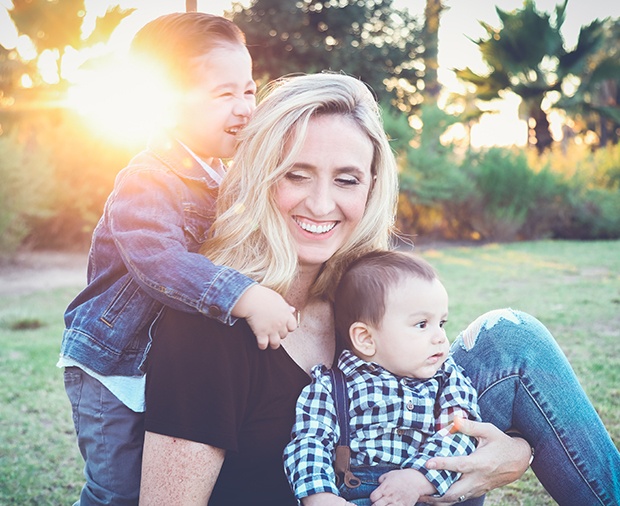 Mother and kids laughing together after children's dentistry visit