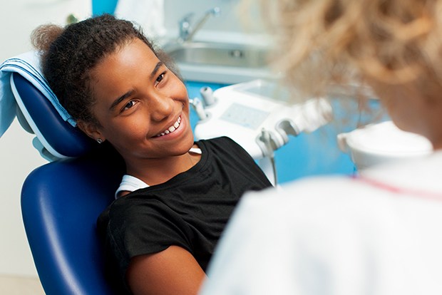 Child smiling after receiving dental sealants