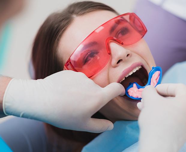 Dental patient receiving fluoride treatment