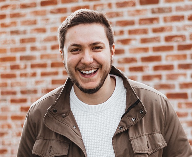 Man with healthy smile after root canal therapy