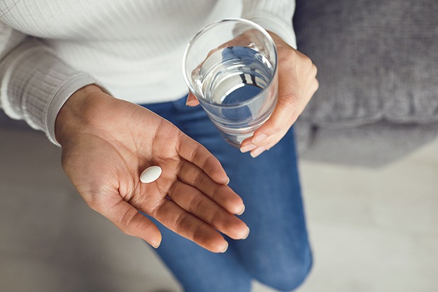 Dental patient taking oral conscious dental sedation pill