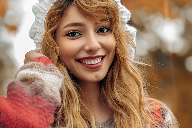 Woman with brilliant smile after teeth whitening