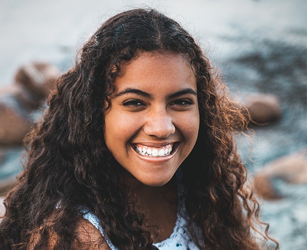 Young woman with healthy smile after wisdom tooth extractions