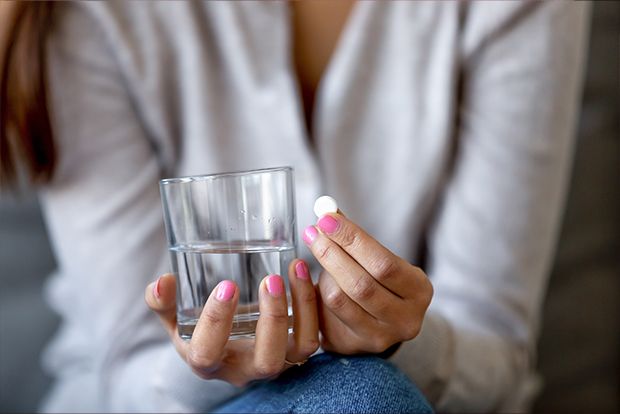 Woman holding an oral conscious dental sedation pill