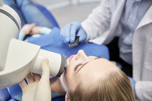 Dental patient receiving digital x-ray scans