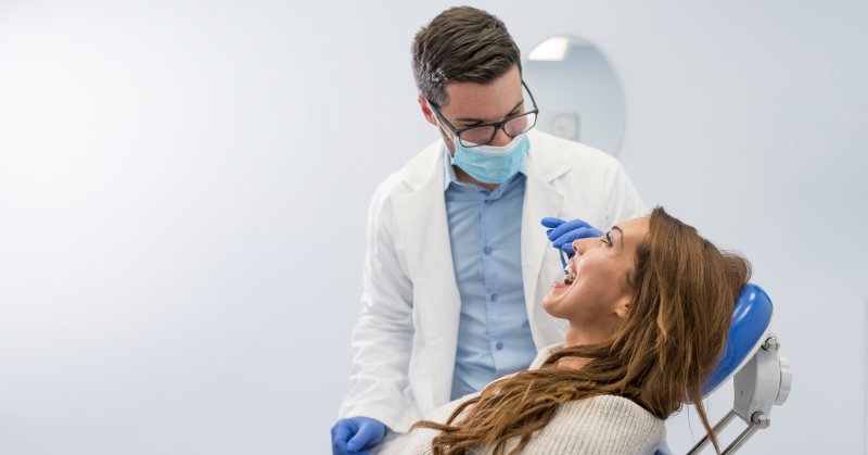 dentist performing checkup in Bedford